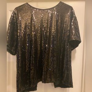 Black sequin open back shirt.